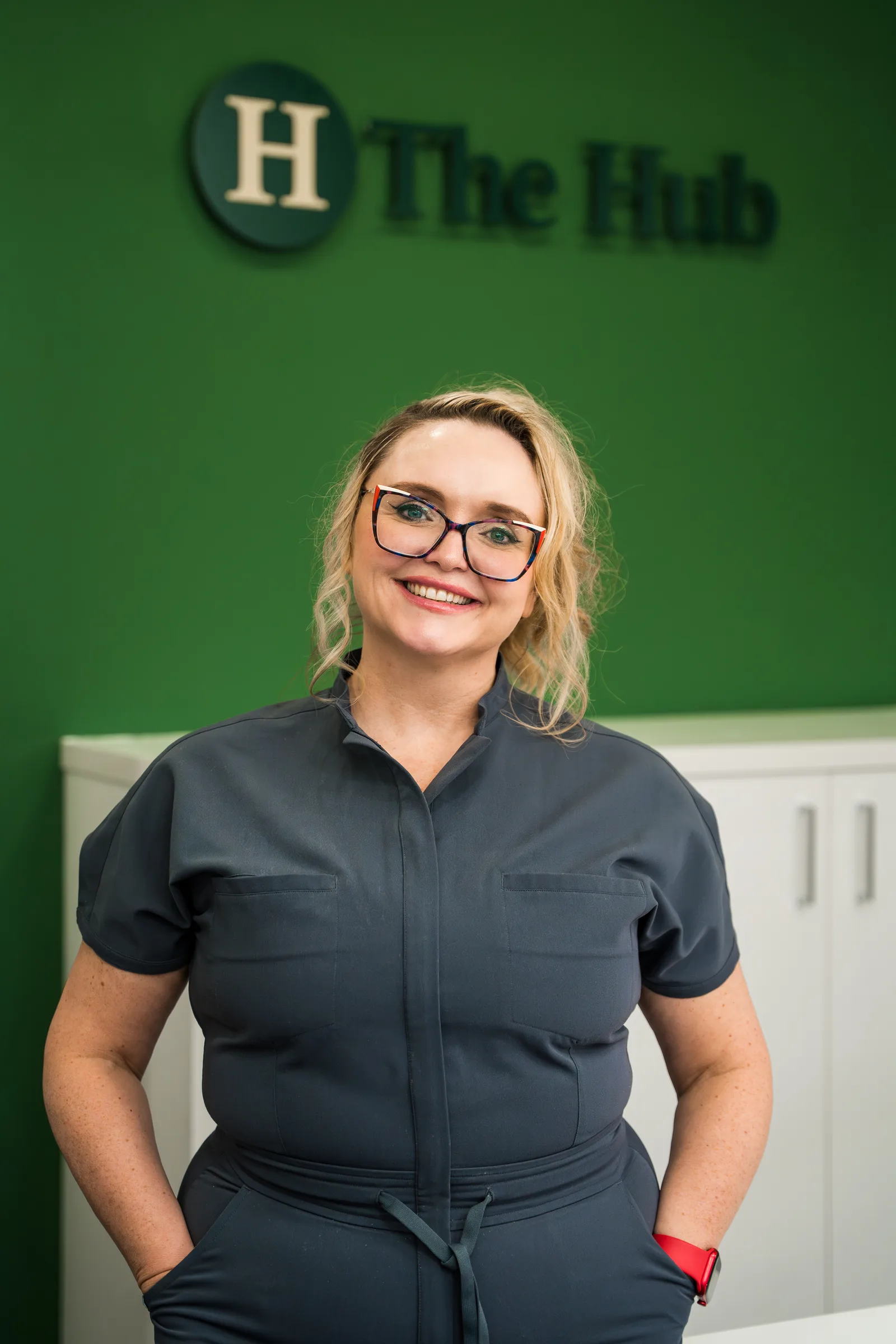 Front-facing member of The Hub Glasgow team in the treatment room