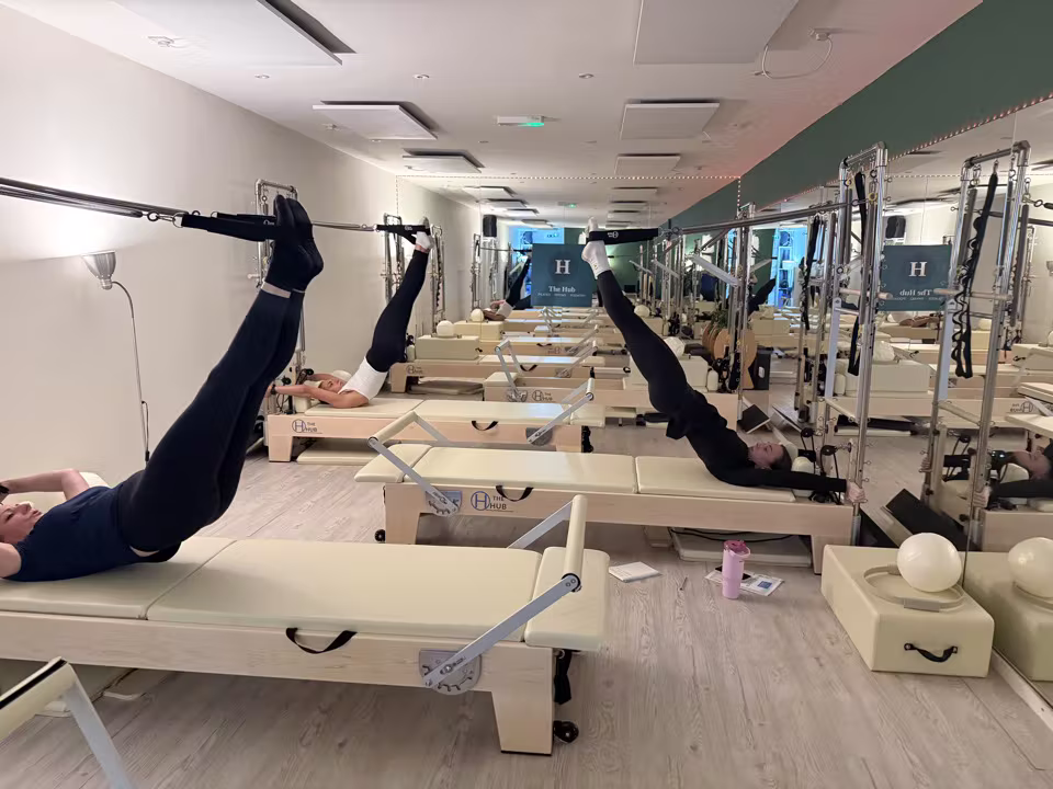 Pilates members training on Reformers at The Hub Glasgow